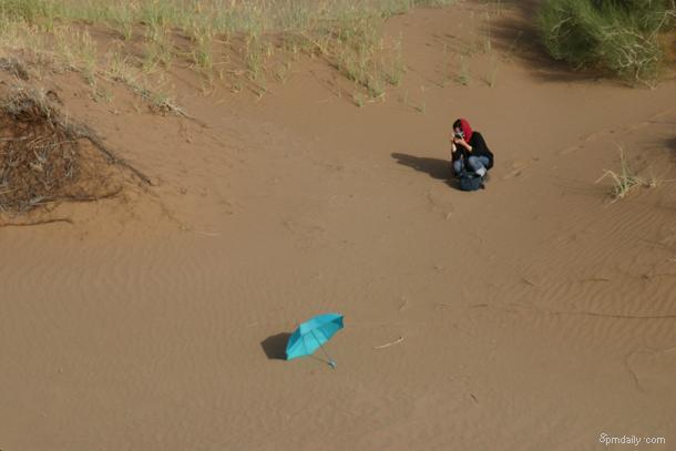 Girl with blue umbrella